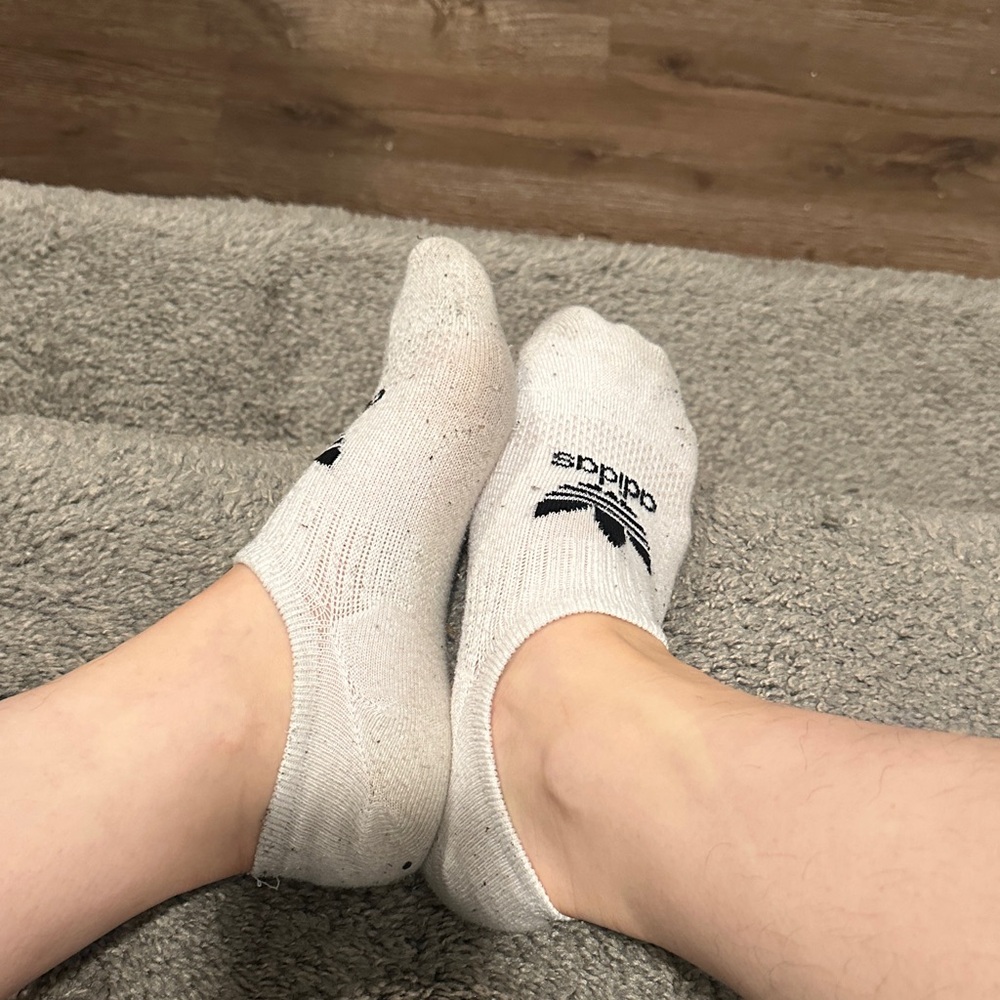 Well worn white adidas women’s socks